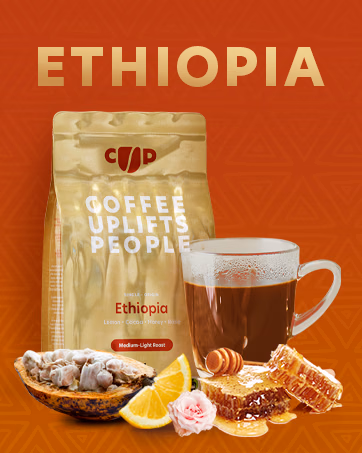 Ethiopia single-origin coffee bag and a cup of coffee, with lemon, cocoa, honey, and a rose illustrating the flavor notes.